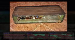 Open wooden device enclosure with visible circuit board and wiring on a tiled floor