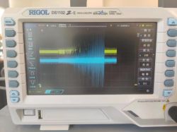 Interference Signal on Rigol DS1102 Oscilloscope Digital oscilloscope displaying signal interference in waveforms.
