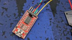 Electronic Module with Wires Electronic module with connected wires on a blue background.
