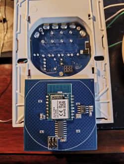 Electronic module with a blue PCB and components.