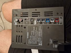 Rear panel of Hyundai Cinema HHE-272006 subwoofer with various audio input and output ports, top view.