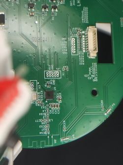 Circuit Board with Electronic Components Close-up of a circuit board with electronic components, including a chip and connectors.
