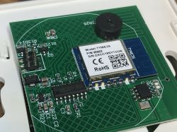 TYWE3S WiFi Module on PCB Close-up of a PCB with TYWE3S WiFi module and a buzzer.
