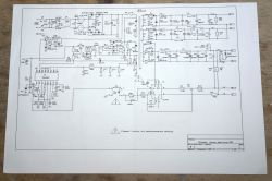B90 amplifier circuit schematic printed on paper placed on a wooden surface