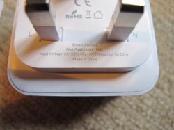 UK Smart Plug with Specification Label Close-up of a UK smart plug with electrical pins and specification label.