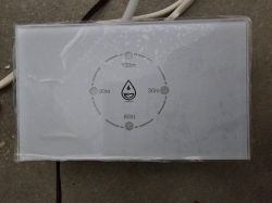 Water boiler switch with four touch buttons, time markings, and a drop symbol in the center.