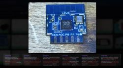 Close-up of CB2S PCB module with Beken BK7231N chip on a wooden surface