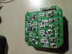 Close-up of a green circuit board with various electronic components.