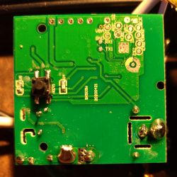 Feit BK7231T Circuit Board with Solder Pads Feit circuit board with visible solder pads and a button.