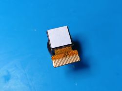 Mini camera module with FFC cable and 18-pin connector Camera module with a flexible flat FFC cable and 18-pin connector on a blue background.