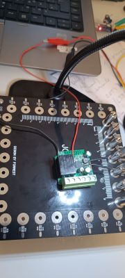 Circuit board with electronic components on a workspace.