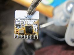 Electronic module with small components and BW2L marking.
