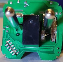 Close-up of Smart Plug Circuit Board Close-up of a printed circuit board with electronic components such as contacts and traces.