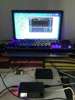 DP100 power supply connected to a laptop running monitoring software
