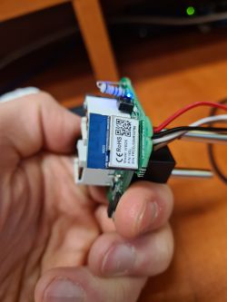 Close-up of an electronic module held in hand.