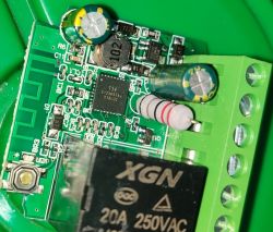 Close-up of a circuit board from a smart Wi-Fi switch with various electronic components.