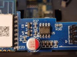 PCB with BGL8022K microchip and surface-mount components Close-up of a blue PCB with a BGL8022K microchip and various electronic components