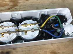 Inside of Woox R4027 Power Strip Interior of a power strip with visible wires and electronic components