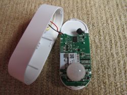 Interior of Tuya PIR/alarm Device Interior of Tuya PIR/alarm device showing the circuit board and sensor.