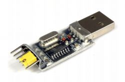USB to TTL adapter with a transparent casing.