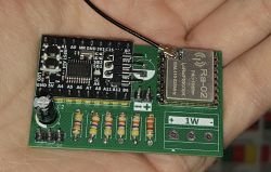 PCB with Ra-02 module and microcontroller held in a hand