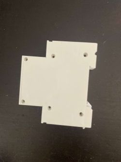 Back Part of DIN Rail Relay Housing View of the back part of a white DIN rail relay housing.