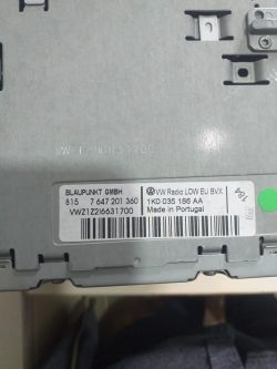 Close-up of the back of a car device with an informational label.