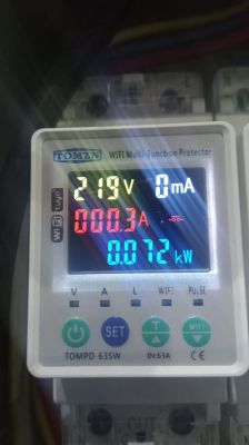 Display of TOMZN TOMP 63SW device with voltage, current, and power meters.