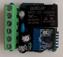 QLRELAY relay module on PCB with capacitors and a Wi-Fi control module