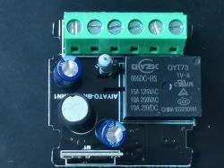 Top view of a relay module with electrical specification markings.