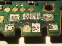 Niezależna ekspertyza uszkodzenia portu USB w Nokia E7-00 po serwisie Regenersis