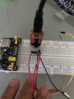 A breadboard with a connected USB TTL module and wires.