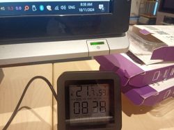 Monitor display with system information and a timer next to it.