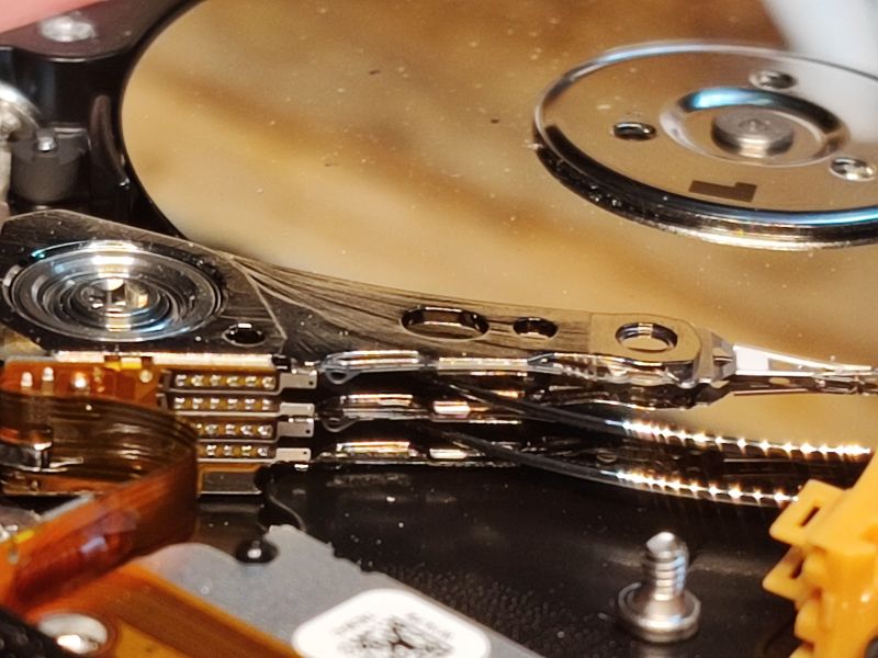 HDD Interior with Head and Platter Inside of an HDD showing the head and platter
