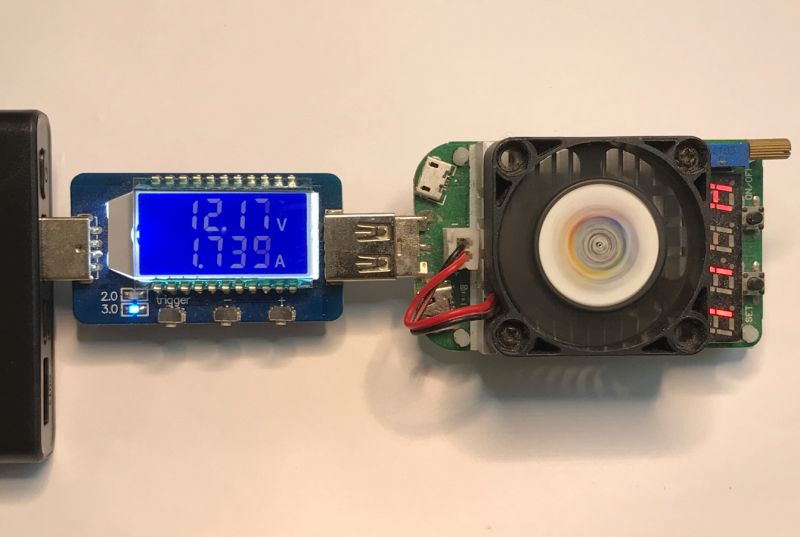 USB tester shows 12.17 V and 1.739 A with a connected power bank and load with fan