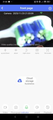 Close-up of a toothbrush captured by a surveillance camera.