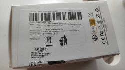 Box with Smart Plug Label White box with a label featuring a barcode and product information, including CE markings and Made in China.