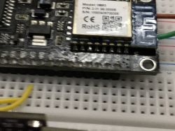 Electronic module placed on a breadboard.