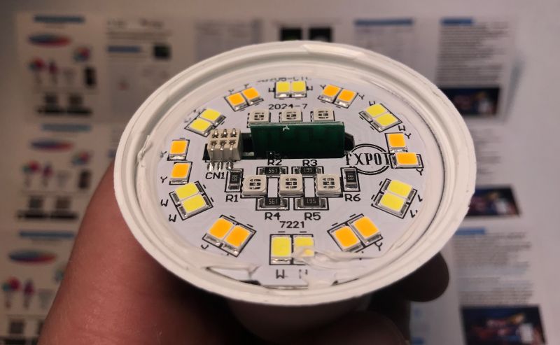 LED PCB of TNCE Smart E27 Bulb Close-up of LED PCB with yellow diodes and markings.