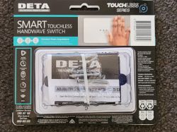 Packaging of the Deta Grid Connect touchless handwave switch with accessories.