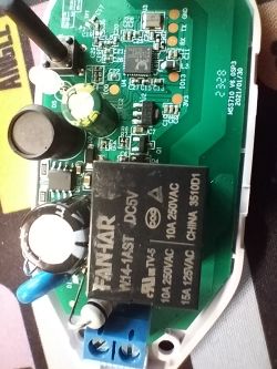 Close-up of a circuit board with electronic components, including a FANHAR W14-1AST relay and capacitors.