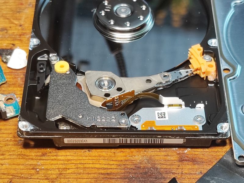 Inside of a Seagate Hard Drive from 2011 Inside of a hard disk drive with visible arm and platter