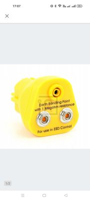 Żółty punkt uziemiający z rezystancją 1 megaom, używany do kontroli ESD.