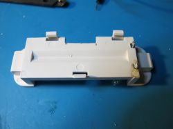 Plastic Casing with Holes and Soldered Wires Plastic device casing with holes and soldered wires.