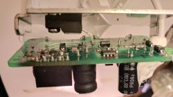 Close-up of electronic components on a circuit board with various components.
