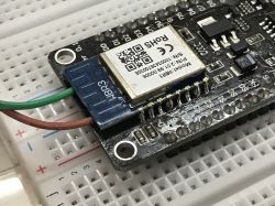 Electronic module on a breadboard with soldered wires.
