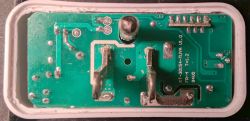 Circuit board of KMC smart plug with electronic components and traces.