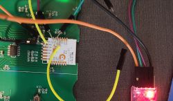 Close-up of a circuit board with connected wires and a CBU chip.
