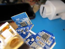 Open Electronic Module with PCBs Close-up of an open electronic module with visible PCBs and components.