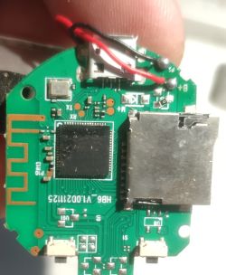 Close-up of a round PCB with the BK7252 chip, micro USB connector, and other electronic components.